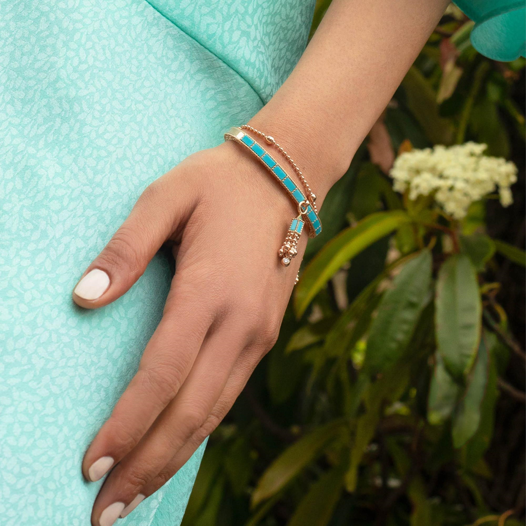 roberto-coin-art-deco-tassel-bangle-18kt-rose-gold-with-turquoise-with-diamonds-mini-version_adv888ba2295_wear-scaled_2bd6b007-d950-47aa-a592-65c9ce9d15cd.jpg