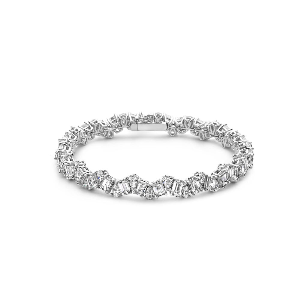 Whitegold tennis bracelet with pear and emerald cut diamonds