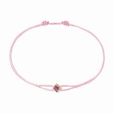 Le Cube cord bracelet in yellow gold with pink sapphire