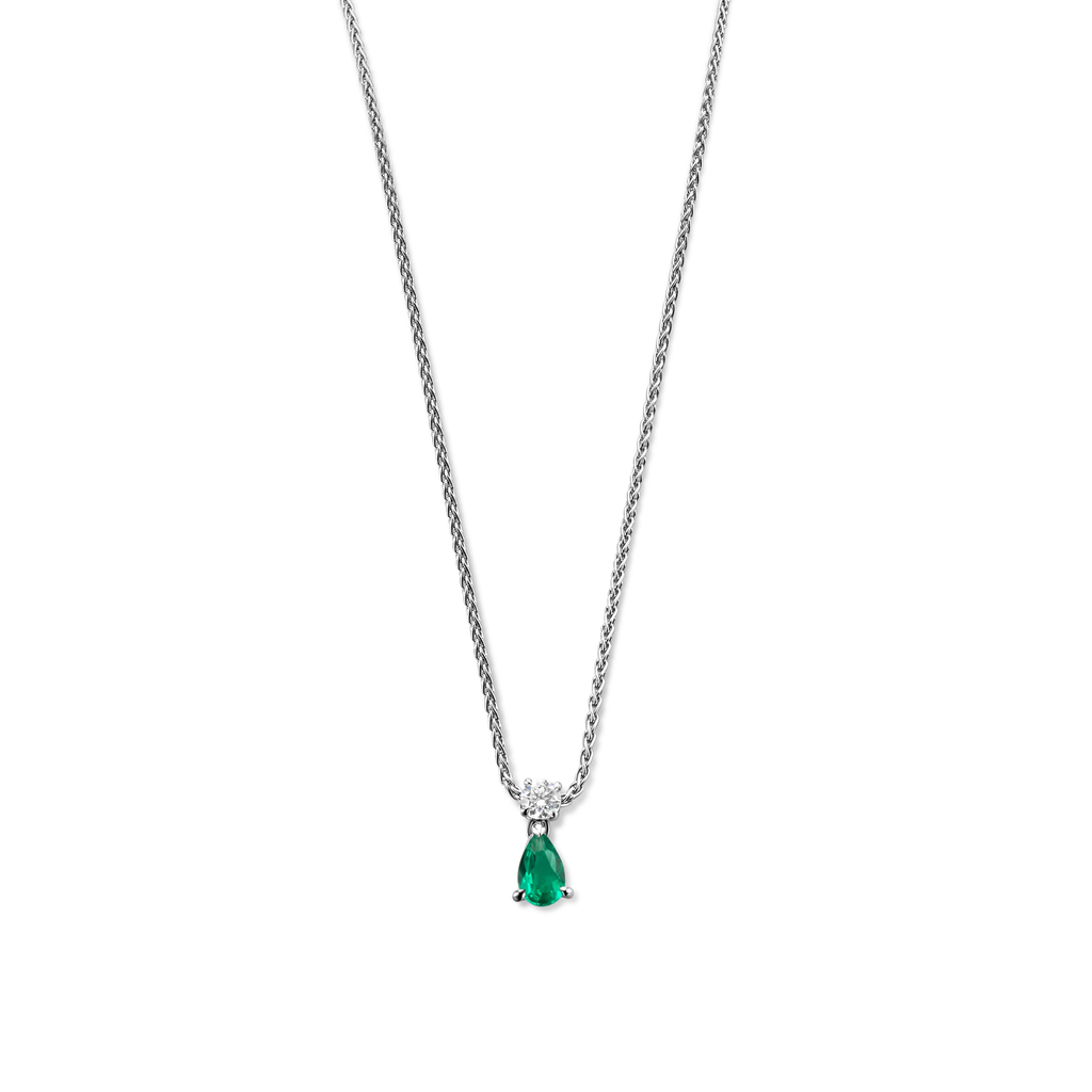 White gold pendant with pear shape emerald and a brilliant cut diamond.