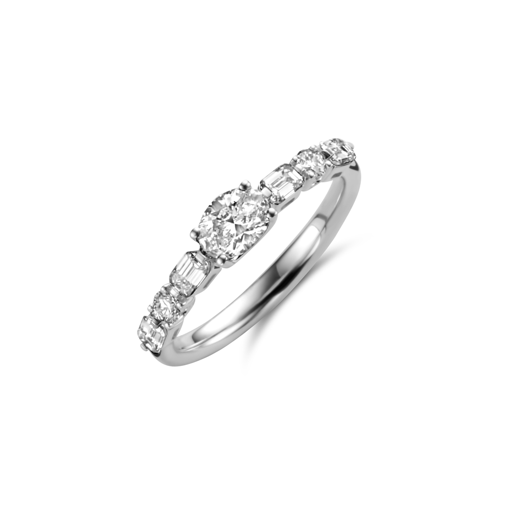 Ring White Gold set with Oval Diamond and brillant and emerald cut diamonds