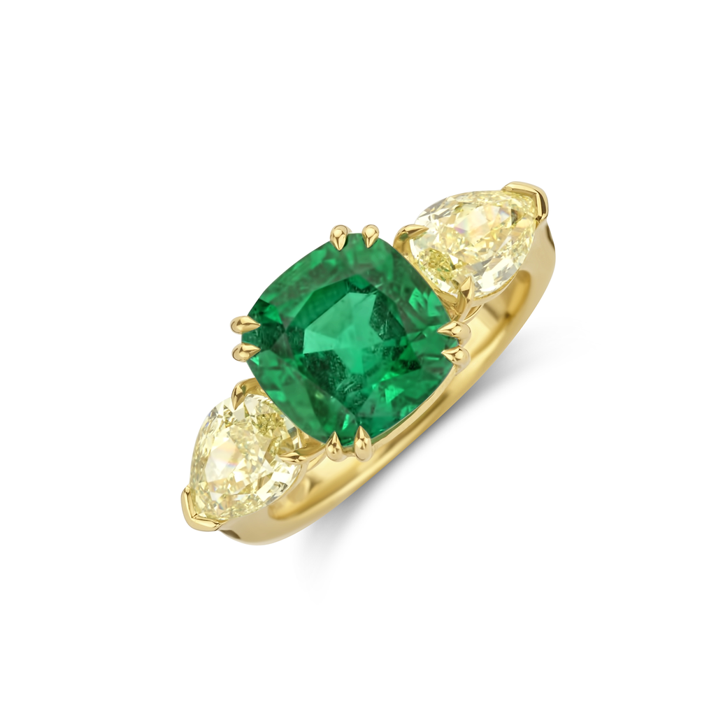 Yellow gold ring with Emerald and 2 Fancy Yellow Pearshape diamonds