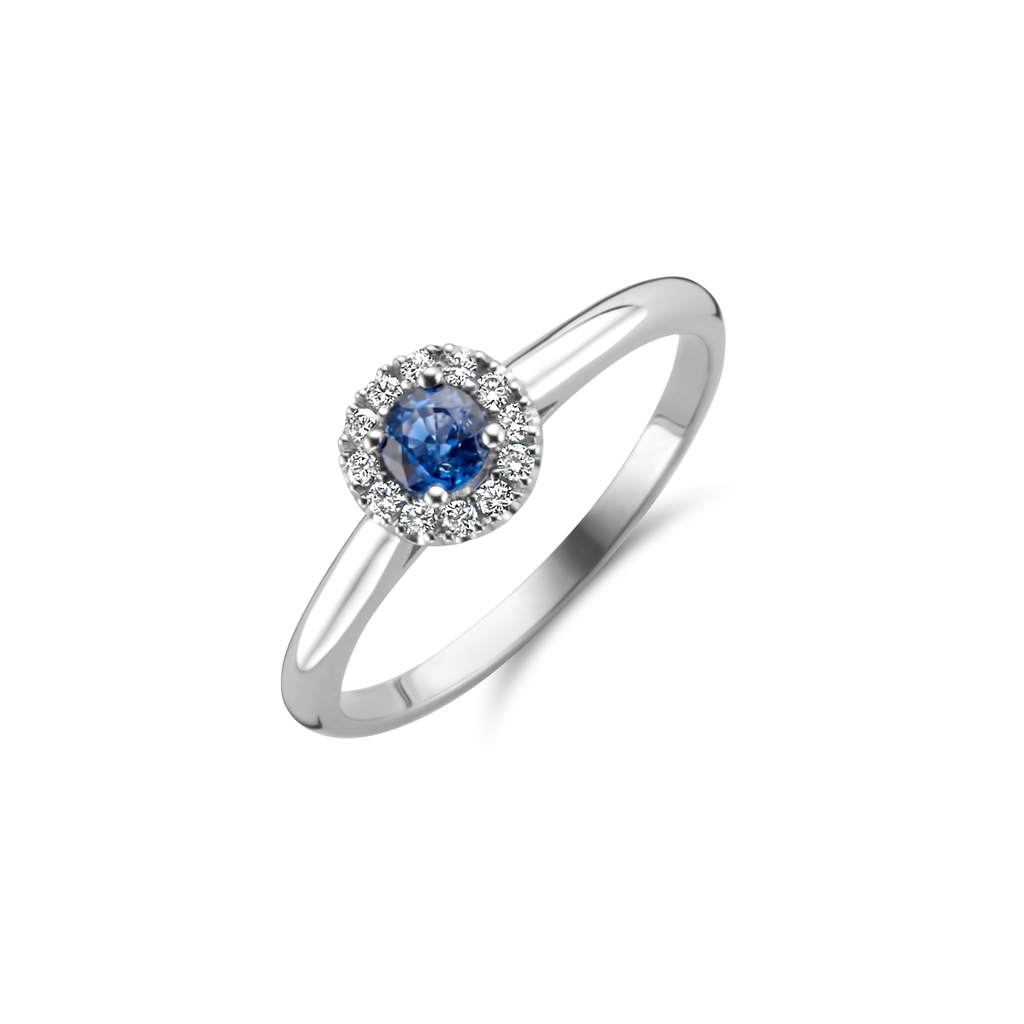 White gold ring with blue sapphire and diamonds
