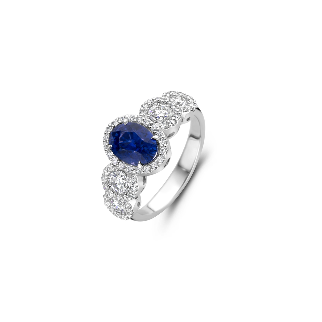 White gold ring with blue sapphire and diamonds