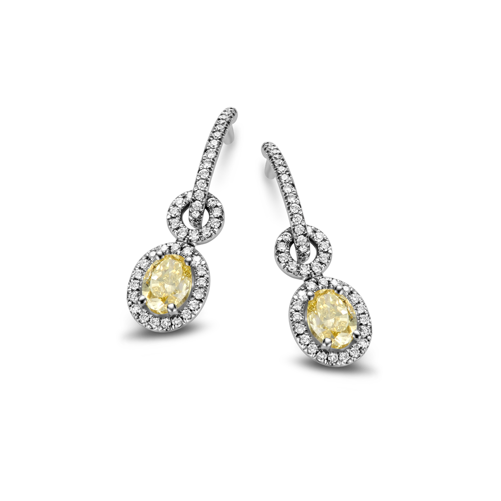 Earrings with fancy yellow oval diamonds