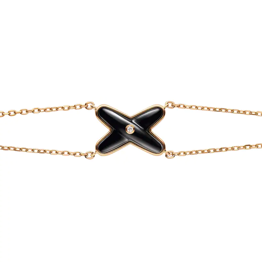 [85122]  Chaumet - Jeux de Liens bracelet in pink gold, set with onyx and a brilliant-cut diamond.